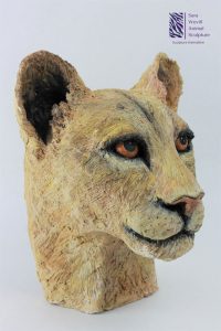Lioness head sculpture in clay