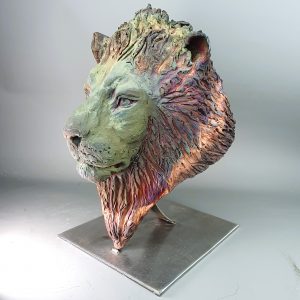 Lion bust in clay fired using raku copper matte technique